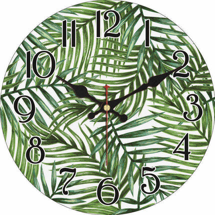 Väggklocka i trä med tropiskt bladmotiv