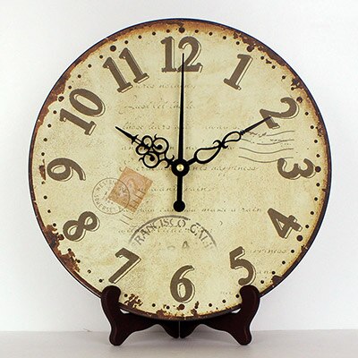 Rund antik bordsklocka med stativ