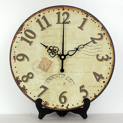 Rund antik bordsklocka med stativ