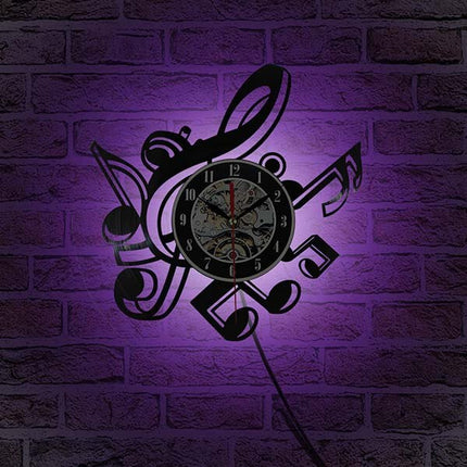 Väggklocka i vinyl med musiknoter