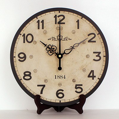 Rund antik bordsklocka med stativ