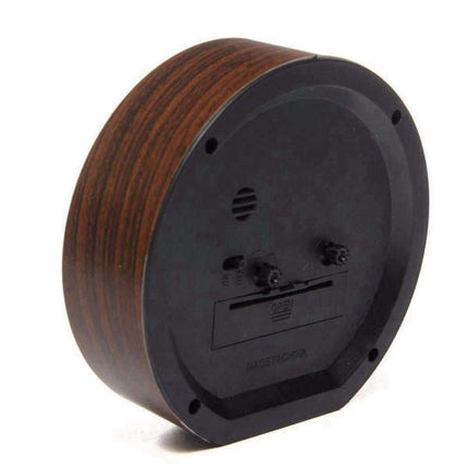 Väggklocka i trä med kamasutra