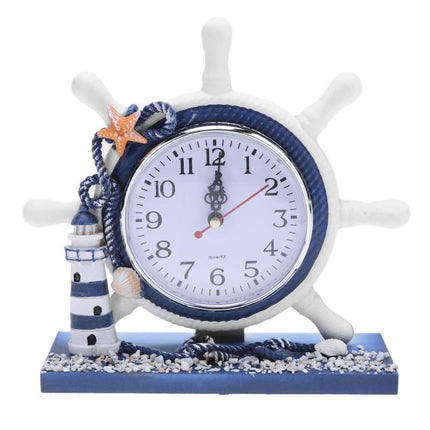 Maritim bordsklocka med fyr och roder