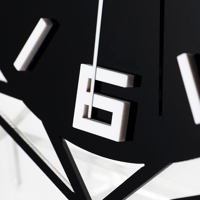 Geometrisk bordsklocka i svart metall