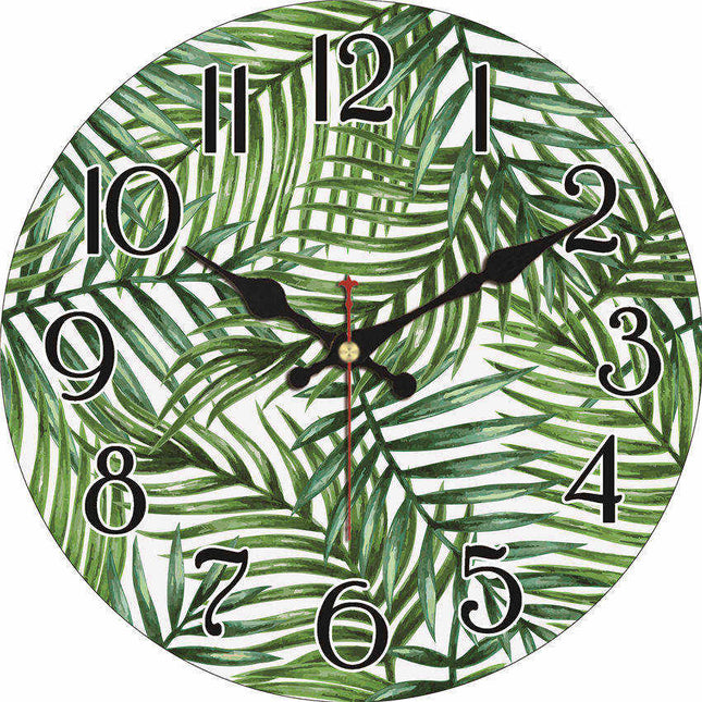 Väggklocka i trä med tropiskt bladmotiv