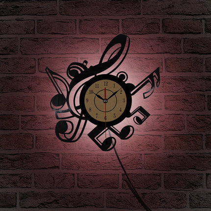 Väggklocka i vinyl med musiknoter