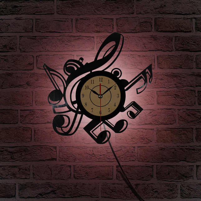 Väggklocka i vinyl med musiknoter