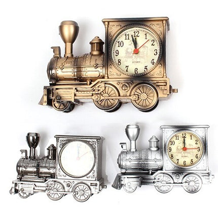 Antik bordsklocka formad som ett ånglok