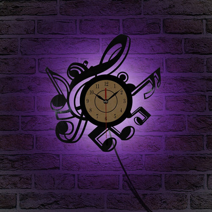 Väggklocka i vinyl med musiknoter