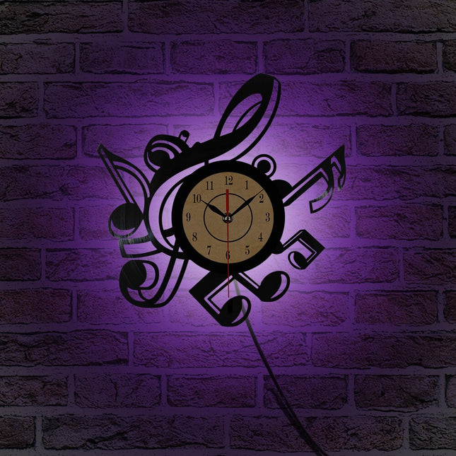 Väggklocka i vinyl med musiknoter