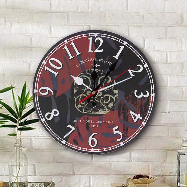 Dekorativ väggklocka i trä med ugglor