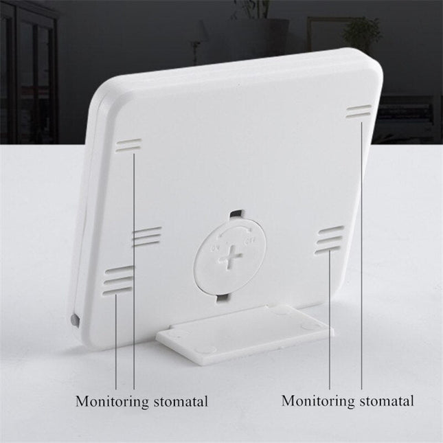 Vit digital bordsklocka med termometer