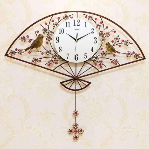 Väggklocka solfjäder med fåglar brons