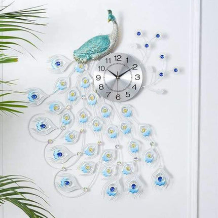 Stor blå väggklocka med påfågelmotiv